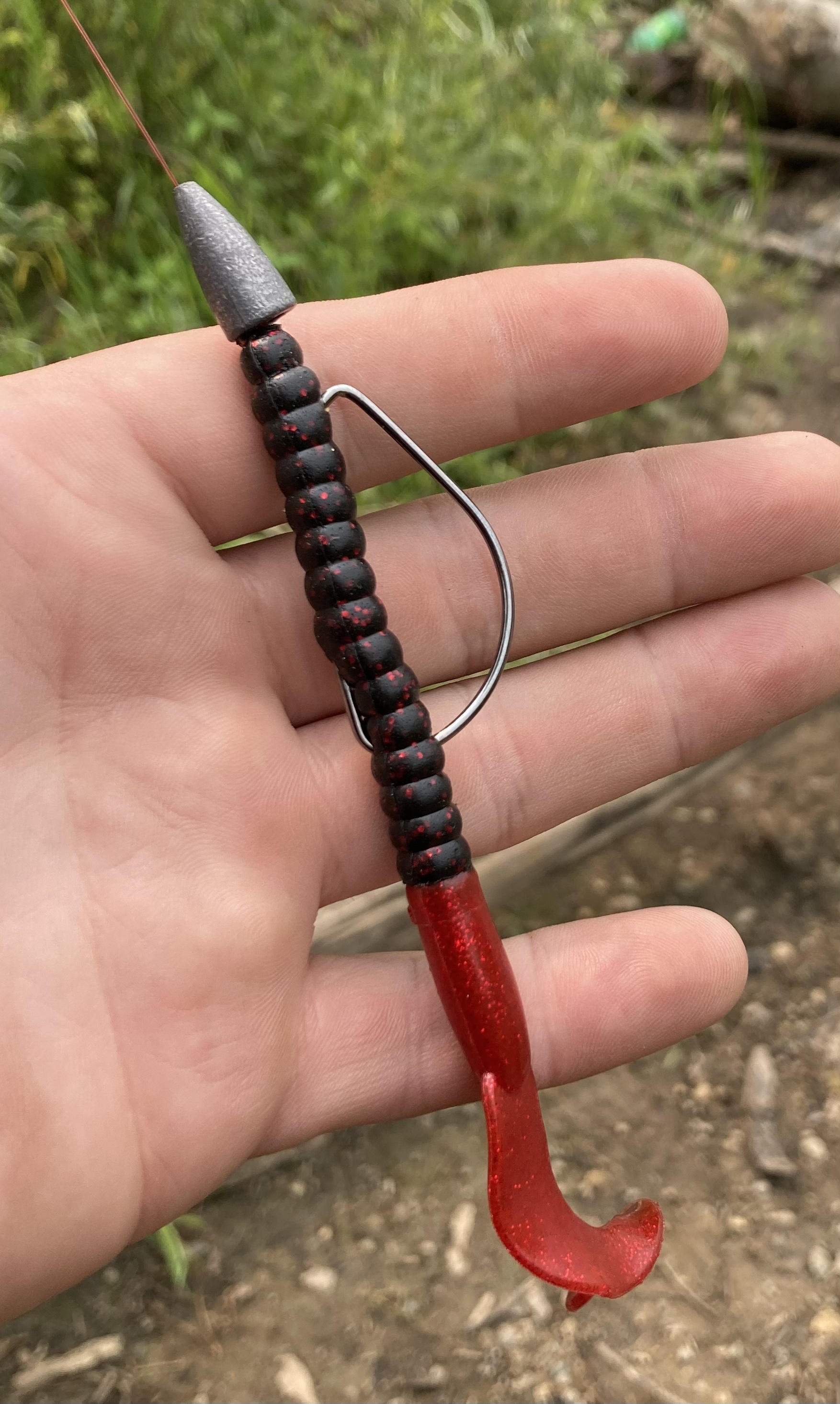 Texas rig fishing setup — soft plastic worm with bullet weight on fluorocarbon line.