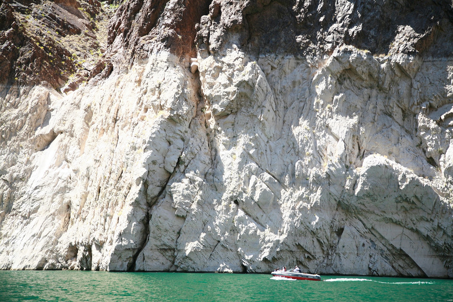 Lake Mead showing dramatic shoreline water levels and red rock formations.